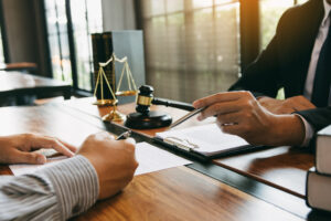 Signing paperwork with attorney